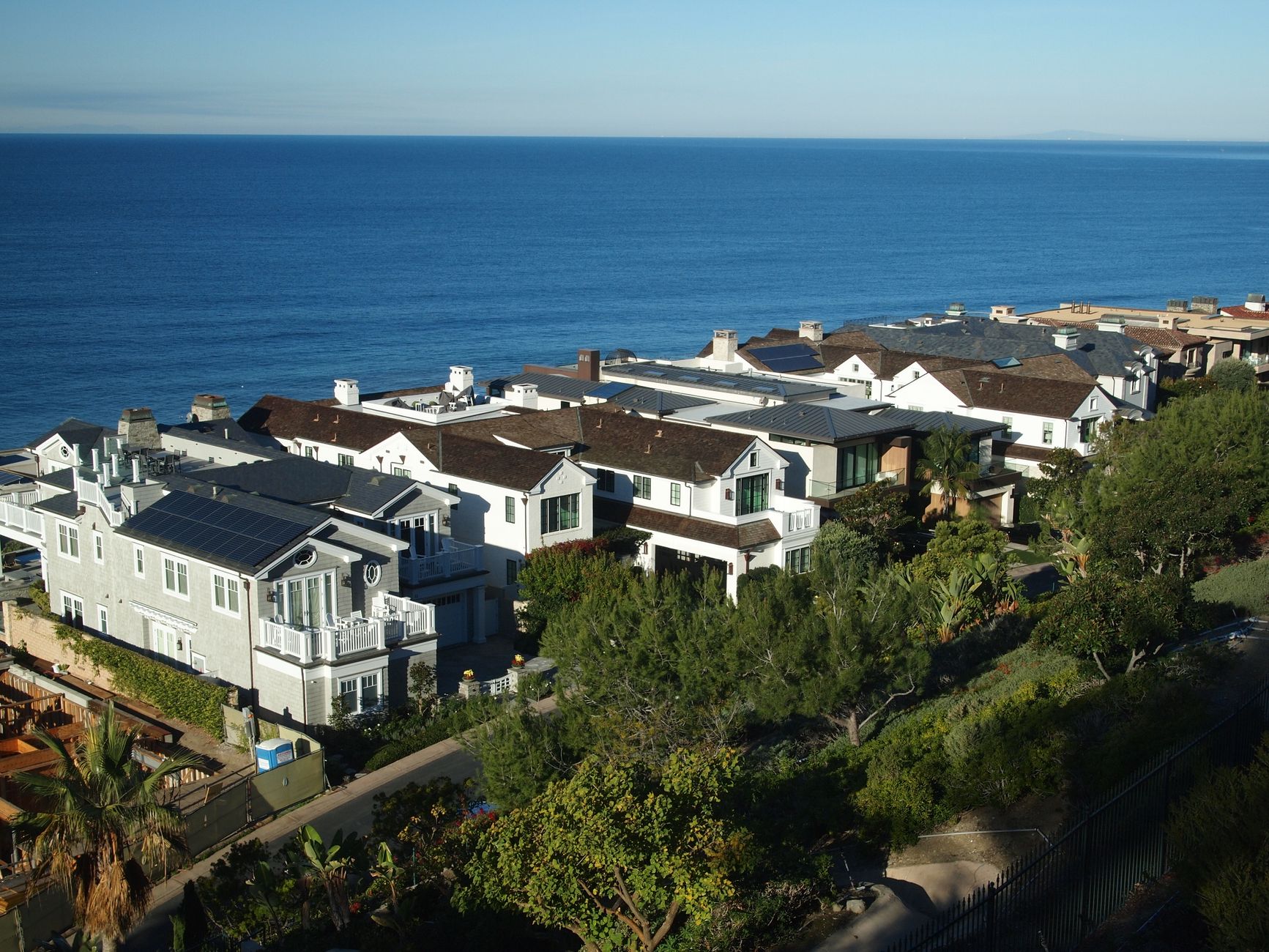 Stunning aerial view of coastal homes and the ocean in Dana Point, California.